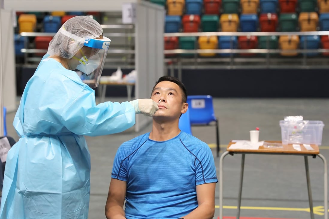 A Hong Kong resident gets a swab taken at a testing station in Wan Chai on September 1, as part of a 14-day universal community testing programme for Covid-19 in the city. Photo: Xinhua