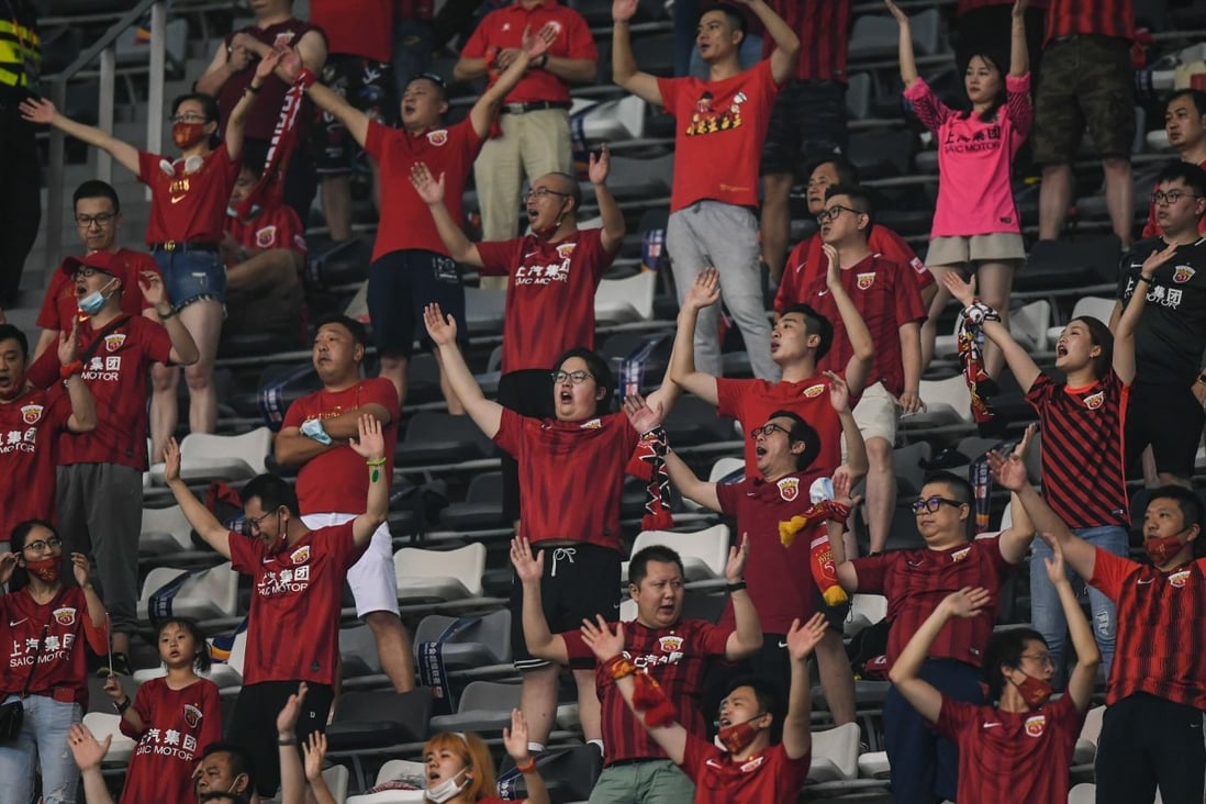 Shanghai SIPG supporters cheer for their team during the sixth round of the Chinese Super League against Beijing Guoan in Suzhou in August. Photo: Xinhua