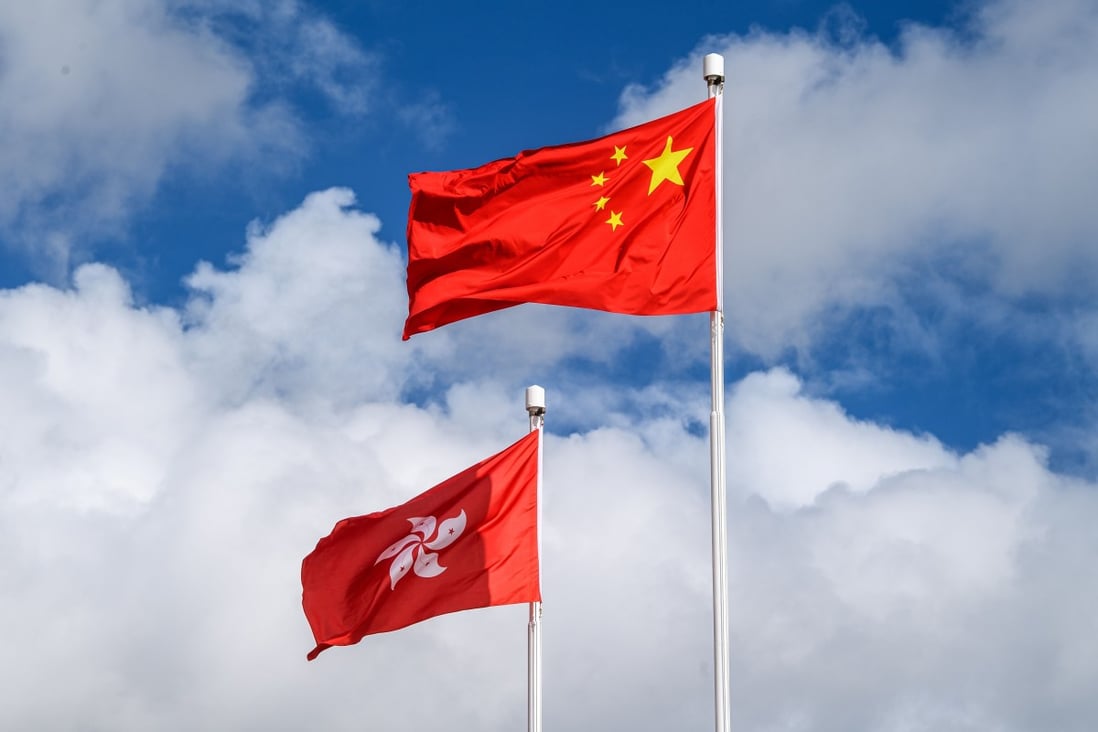 The Chinese and Hong Kong flags. The national security law requires the government to promote national security education at schools and universities. Photo: AFP