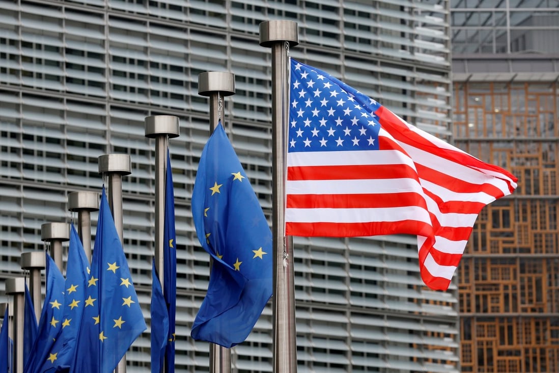 US and European Union flags fly outside the European Commission headquarters in Brussels, Belgium in February 2017. Photo: Reuters