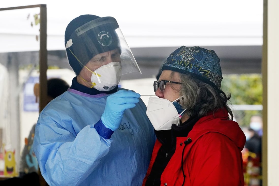 A woman gets a coronavirus swab at a free testing site in Seattle, Washington, on Wednesday. Photo: AP