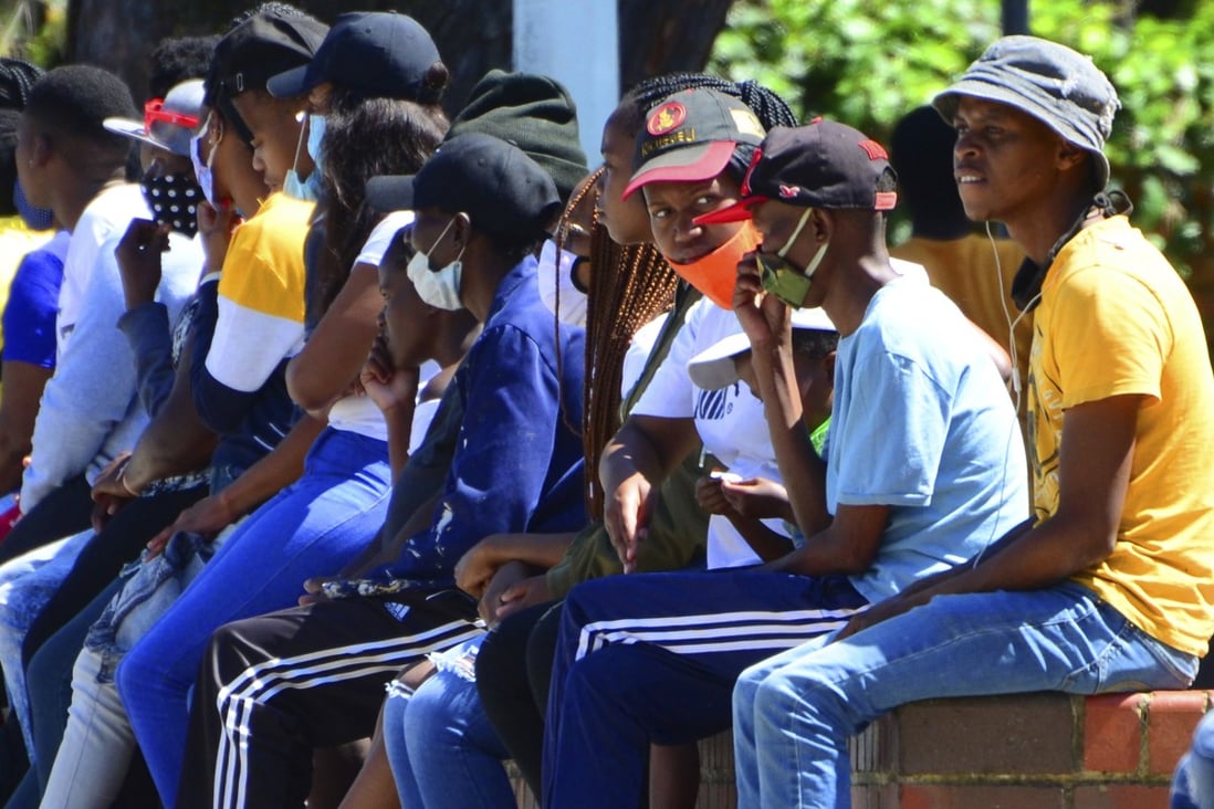 South Africans queue for social grant payments at a post office in Port Elizabeth. Photo: AP