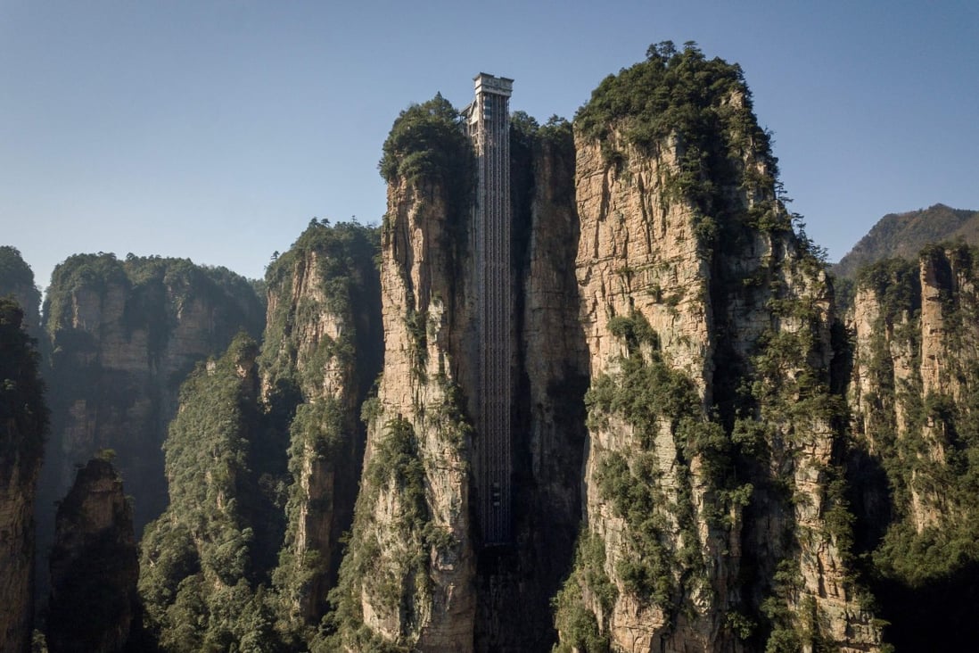 The outdoor lift whisks tourists to breathtaking views of the Zhangjiajie park in Hunan province. Photo: AFP