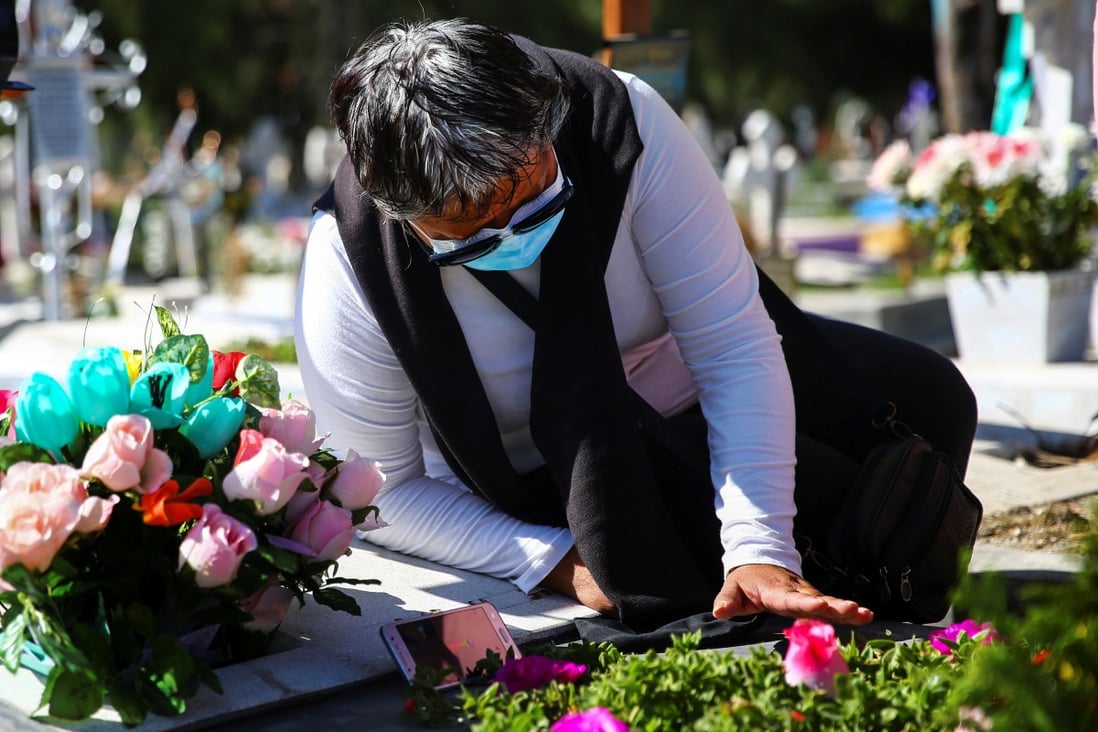 A woman in Mexico visits the grave of her mother, who died of Covid-19 at the age of 86. Photo: Reuters