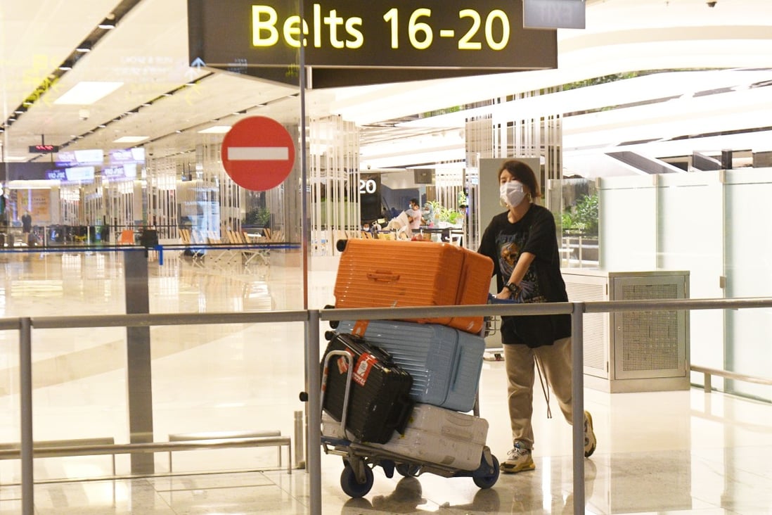 A traveller walks out of the arrival hall after landing at Singapore Changi Airport. Photo: Xinhua