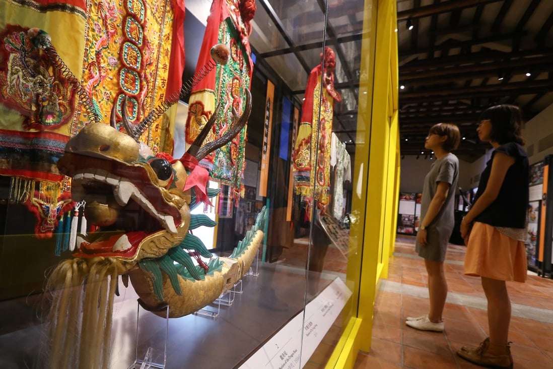 Visitors look at a dragon head for the Tai O dragon boat parade at the Intangible Cultural Heritage Centre in Sam Tung Uk Museum in Tsuen Wan in July 2016. Chinese culture is alive and well in Hong Kong. Photo: Dickson Lee