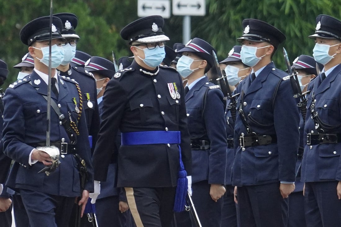 Commissioner of Police Chris Tang inspects officers at Saturday’s passing-out parade. Photo: Winson Wong