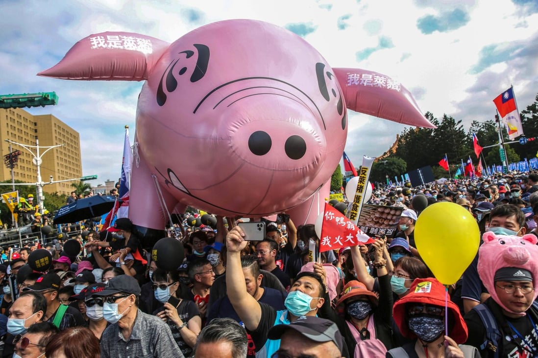 People attend the annual pro-labour march “Autumn Struggle” to protest against the lifting of restrictions on US pork containing ractopamine feed additive, in Taipei on Sunday. Photo: AFP