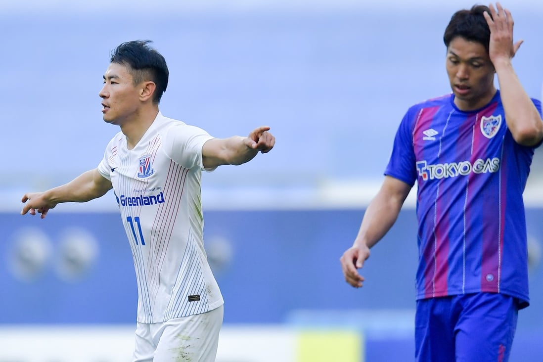 Shanghai Shenhua’s Yu Hanchao wheels away after scoring during against FC Tokyo in their AFC Champions League group F match in Doha. Photo: Xinhua