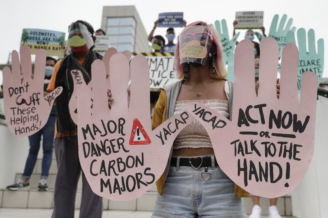 Environmental activists wearing masks to curb the spread of the coronavirus attend a climate change protest in Quezon City, Philippines. Photo: AP