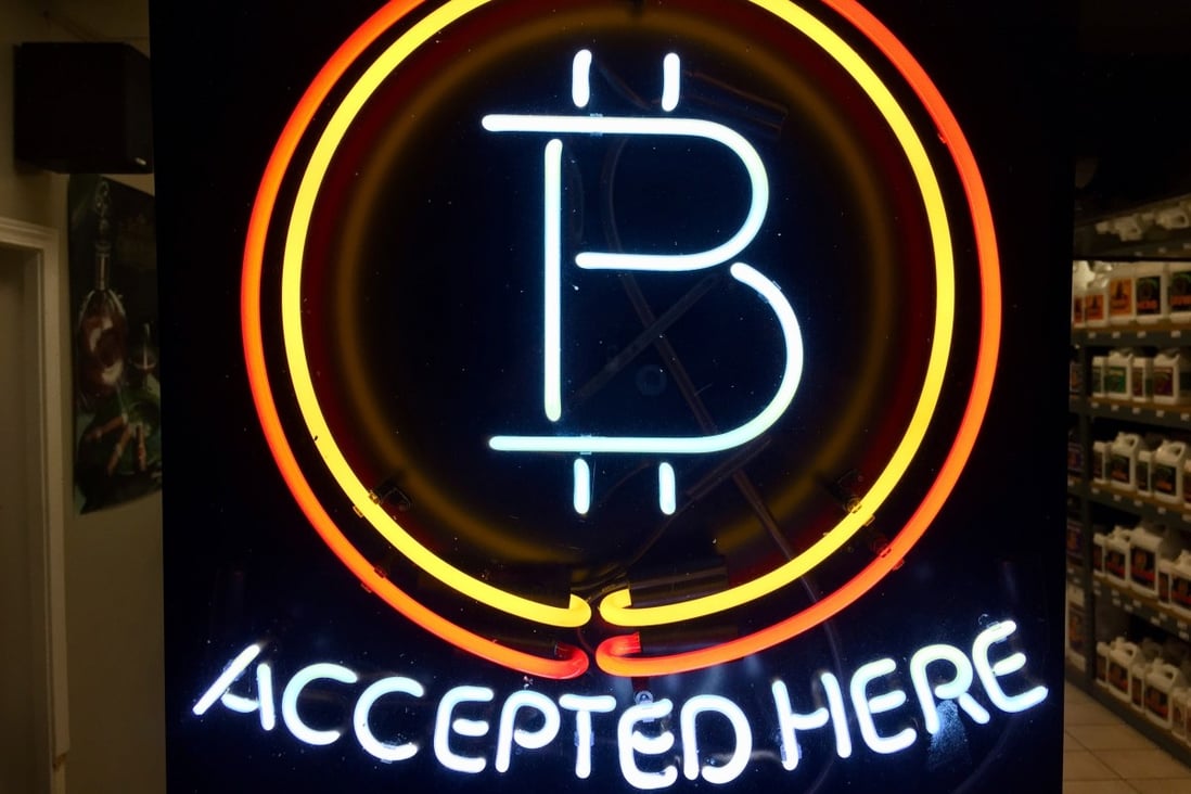A neon sign at a shop in Hillsboro, Oregon, showing that bitcoin is accepted as payment. Photo: AP