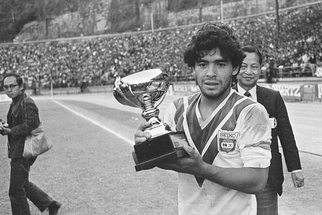 Diego Maradona wears a Seiko jersey and holds the trophy after Boca Juniors beat the Hong Kong side 2-0 in an exhibition match in January, 1982. Photos: SCMP