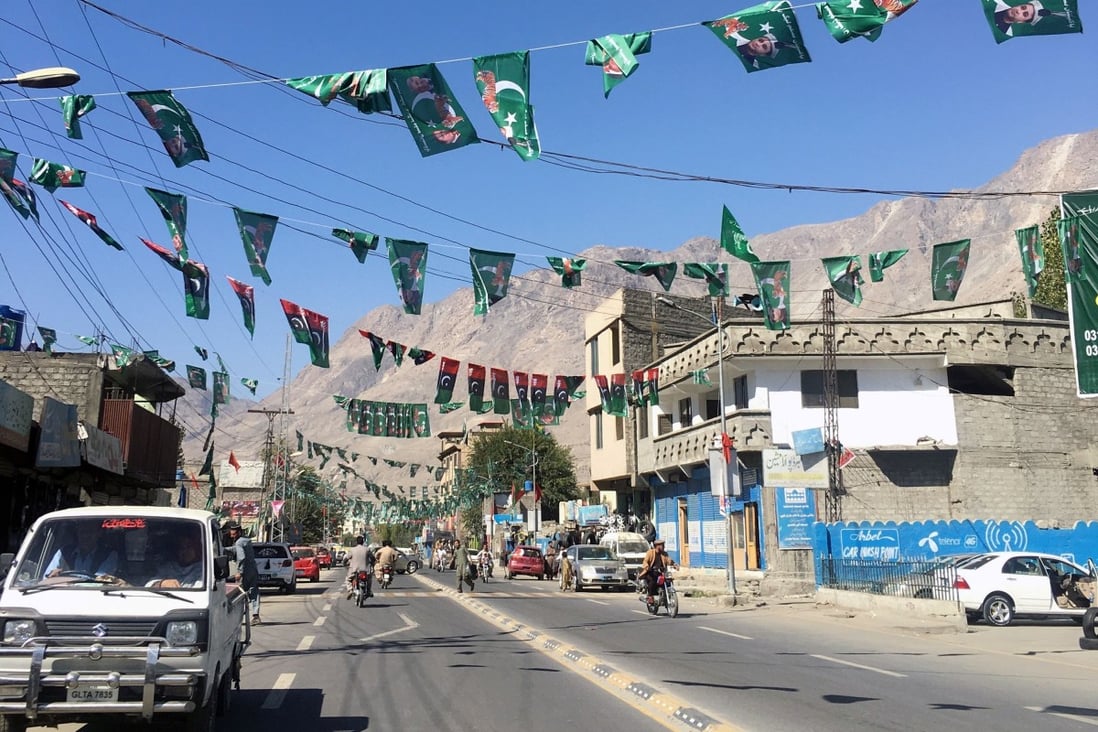 A vehicle drives past campaign flags of different political parties ahead of the legislative assembly elections in Gilgit Baltistan earlier this month. Photo: Reuters