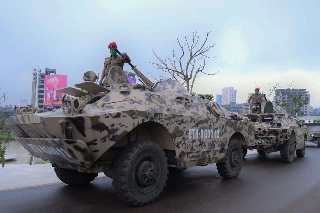 Military vehicles take part in a parade in Addis Ababa in September. Ethiopian Prime Minister Abiy Ahmed has ordered the army to move on the embattled Tigray regional capital. Photo: EPA-EFE