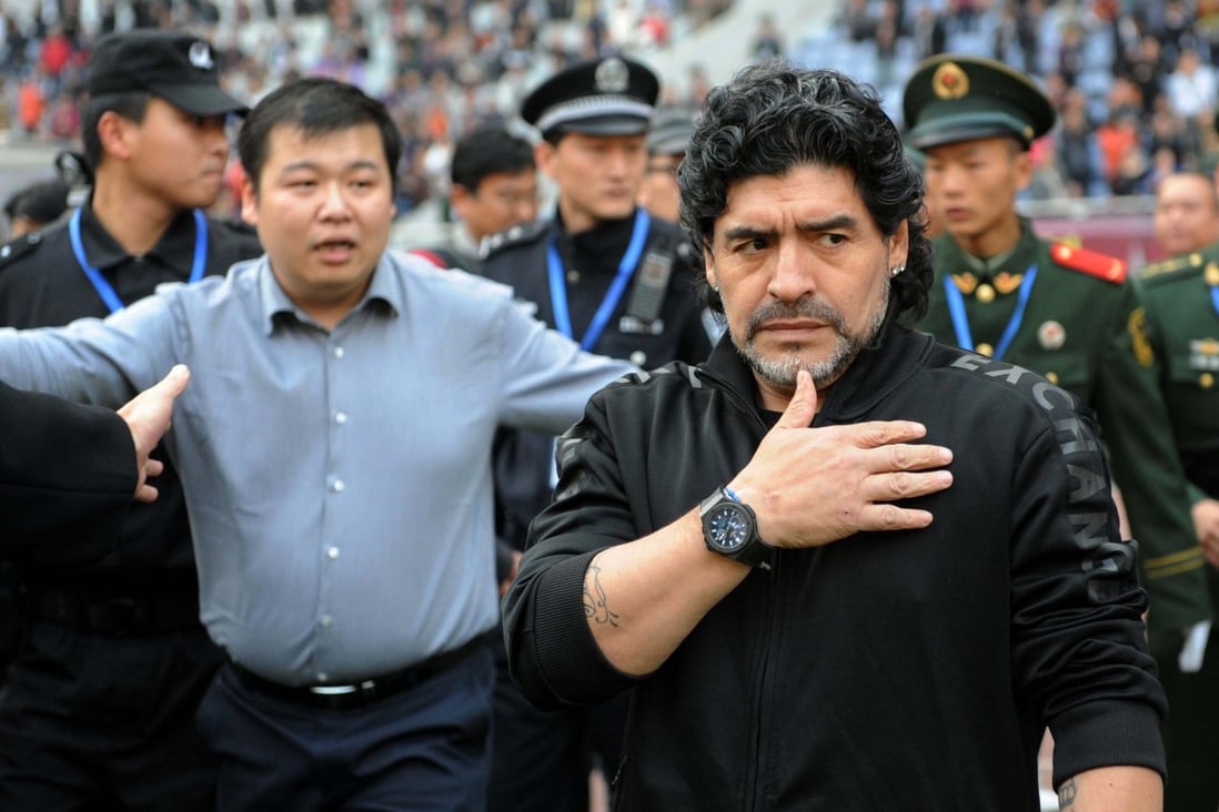 Argentine soccer legend Diego Maradona enters the stadium ahead of a charity football match in Jinan in 2010. Photo: Xinhua