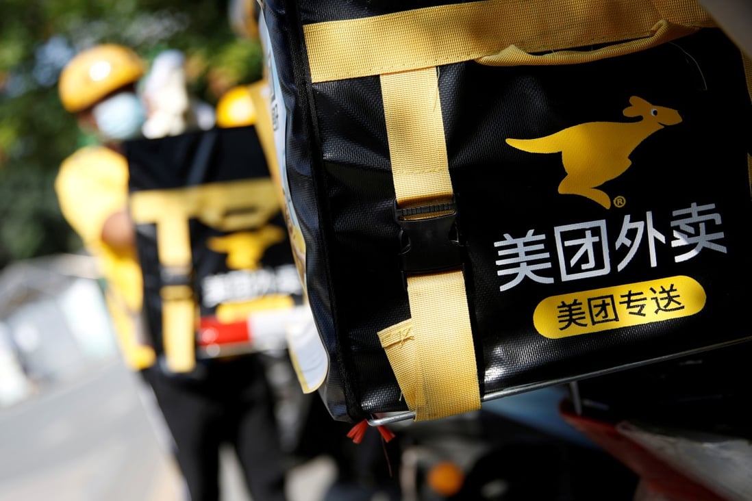 The logo of Meituan is seen on insulated boxes fastened on its food delivery couriers’ motorcycles in the central business district of Beijing. Photo: Reuters
