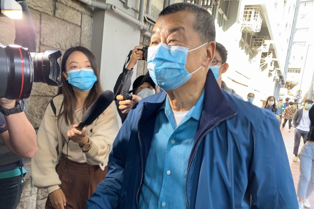 Apple Daily boss Jimmy Lai arrives at the Mong Kok police station shortly before 1pm on Wednesday. Photo: Dickson Lee