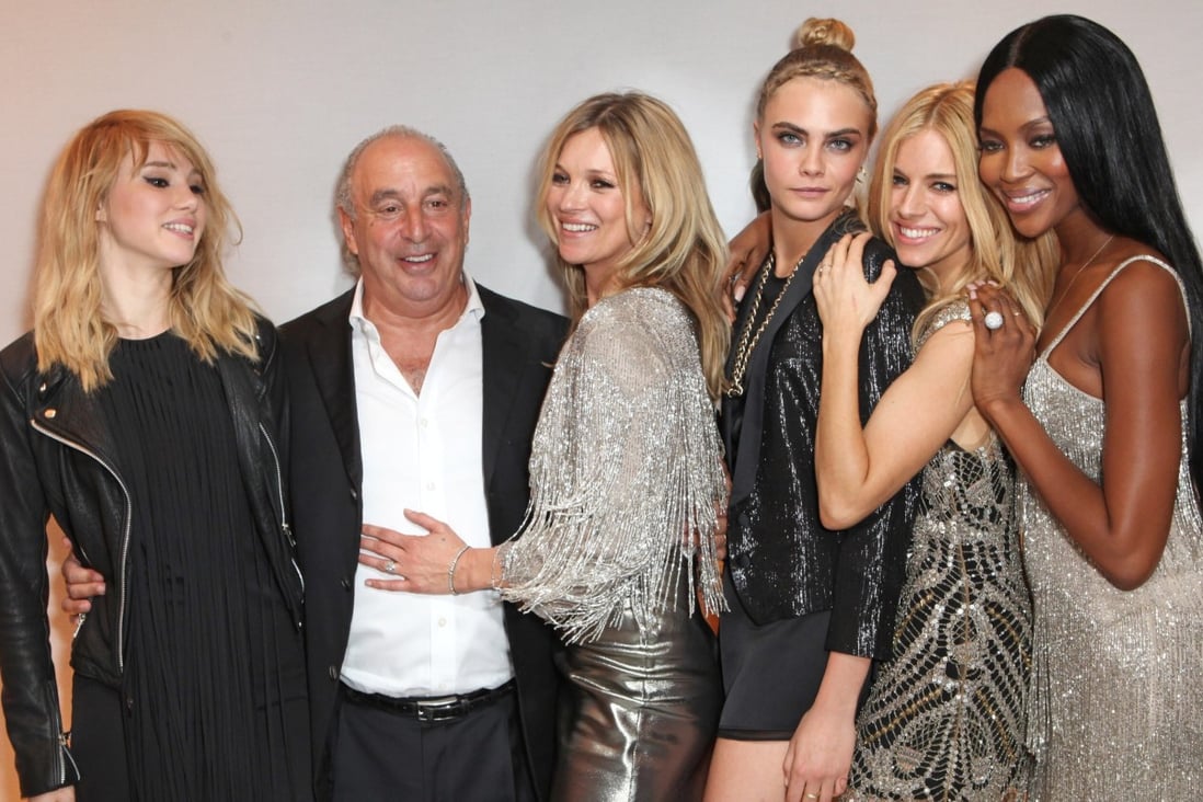 Philip Green with Suki Waterhouse, Kate Moss, Cara Delevingne, Sienna Miller and Naomi Campbell at a private dinner celebrating the Global Launch of the Kate Moss for Topshop Collection at The Connaught Hotel in London in 2014. Photo: Getty Images