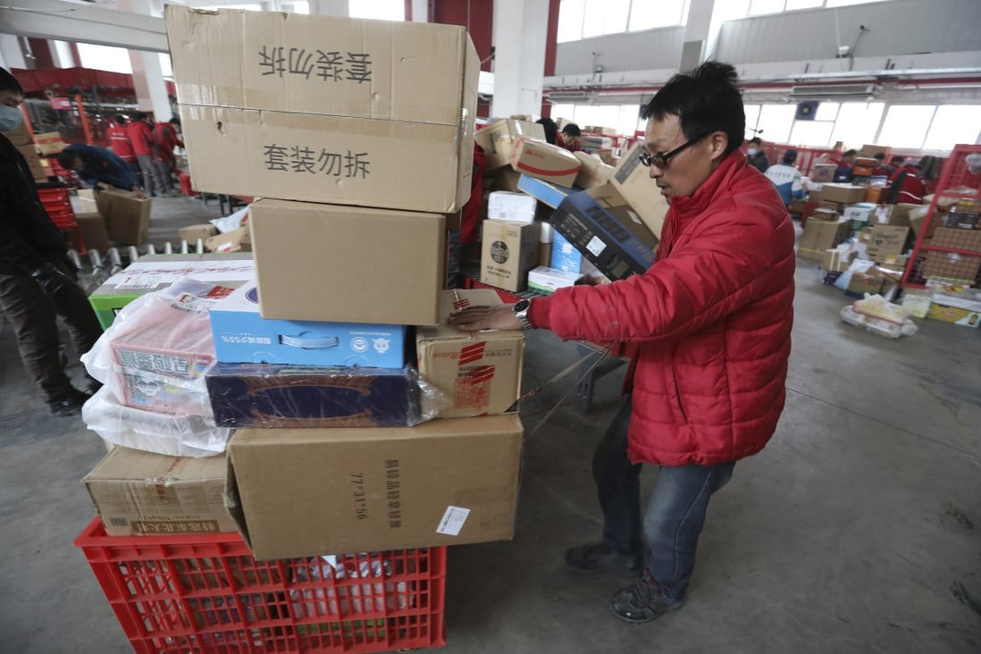 Workers sort out packages for delivery at JD's Yizhuang Smart Delivery Station in Beijing during Singles' Day shopping festival. Photo: Simon Song