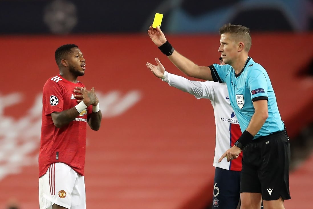 Manchester United’s Fred is shown a yellow card for unsporting behaviour during the Uefa Champions League defeat against Paris Saint-Germain. Photo: DPA