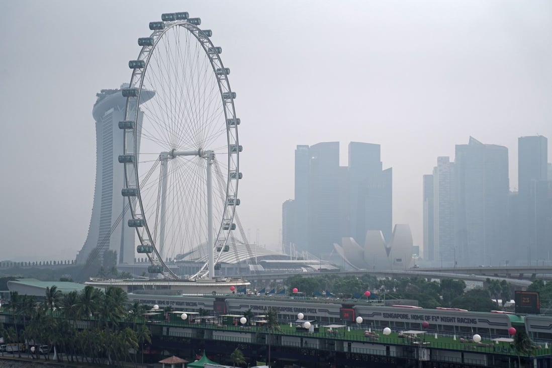 Haze shrouds the Singapore Flyer Ferris wheel in 2019 after wind from neighbouring Indonesia swept in ash and smoke from the illegal burning of forests and farmland. Photo: Bloomberg