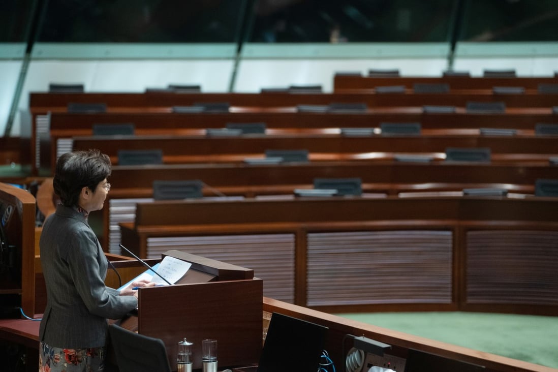 Empty seats during an address by Carrie Lam after the mass resignation of opposition lawmakers. Photo: Bloomberg