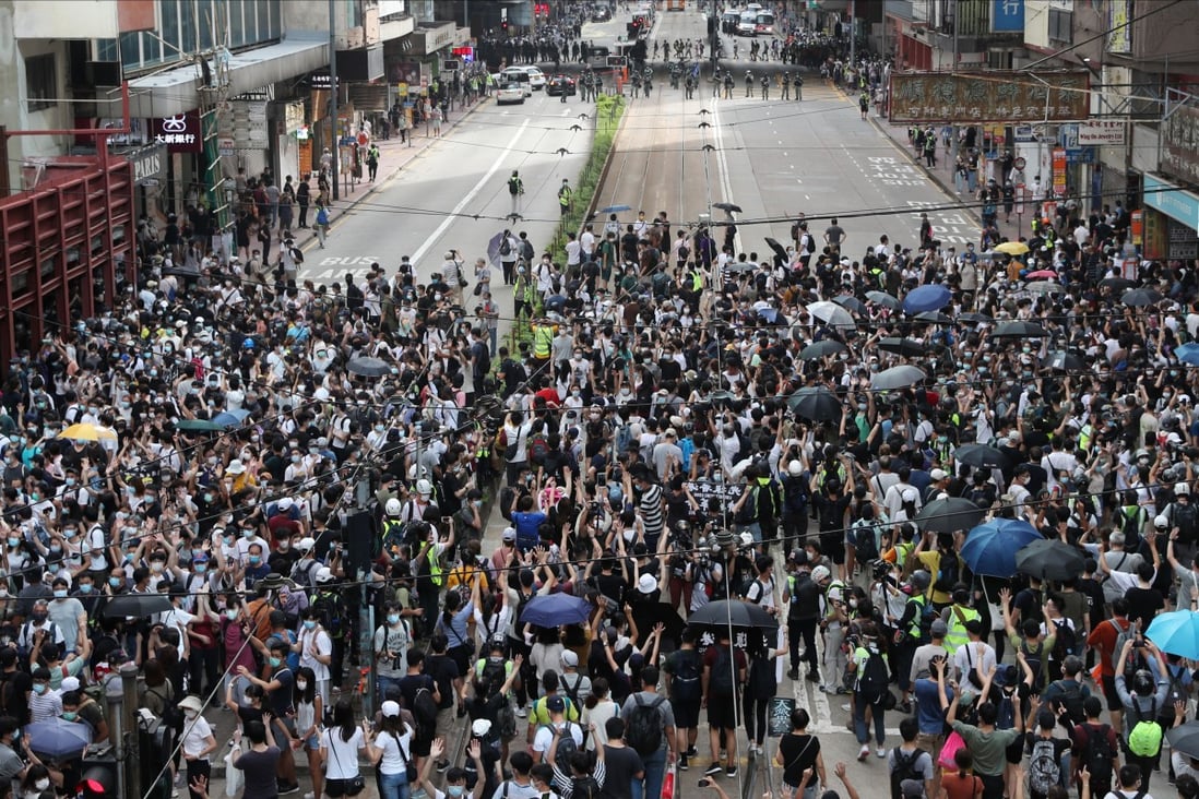 A crowd of anti-government protesters gather on Hennessy Road in Causeway Bay during an illegal march on July 1. Photo: Sam Tsang