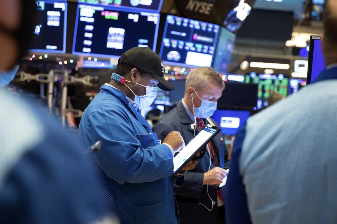 Traders work on the floor of the New York Stock Exchange. Photo: New York Stock Exchange/ AP