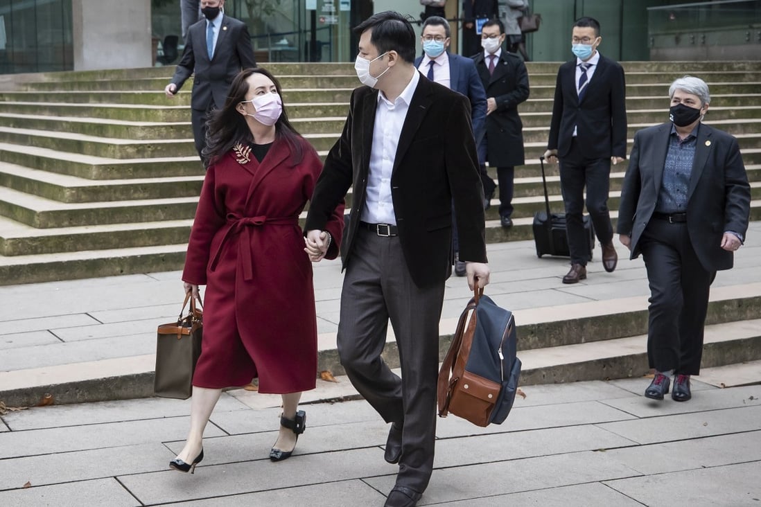 Meng Wanzhou leaves the Supreme Court of British Columbia with her husband, Liu Xiaozong, during a break from a hearing in Vancouver on Thursday. Photo: AP