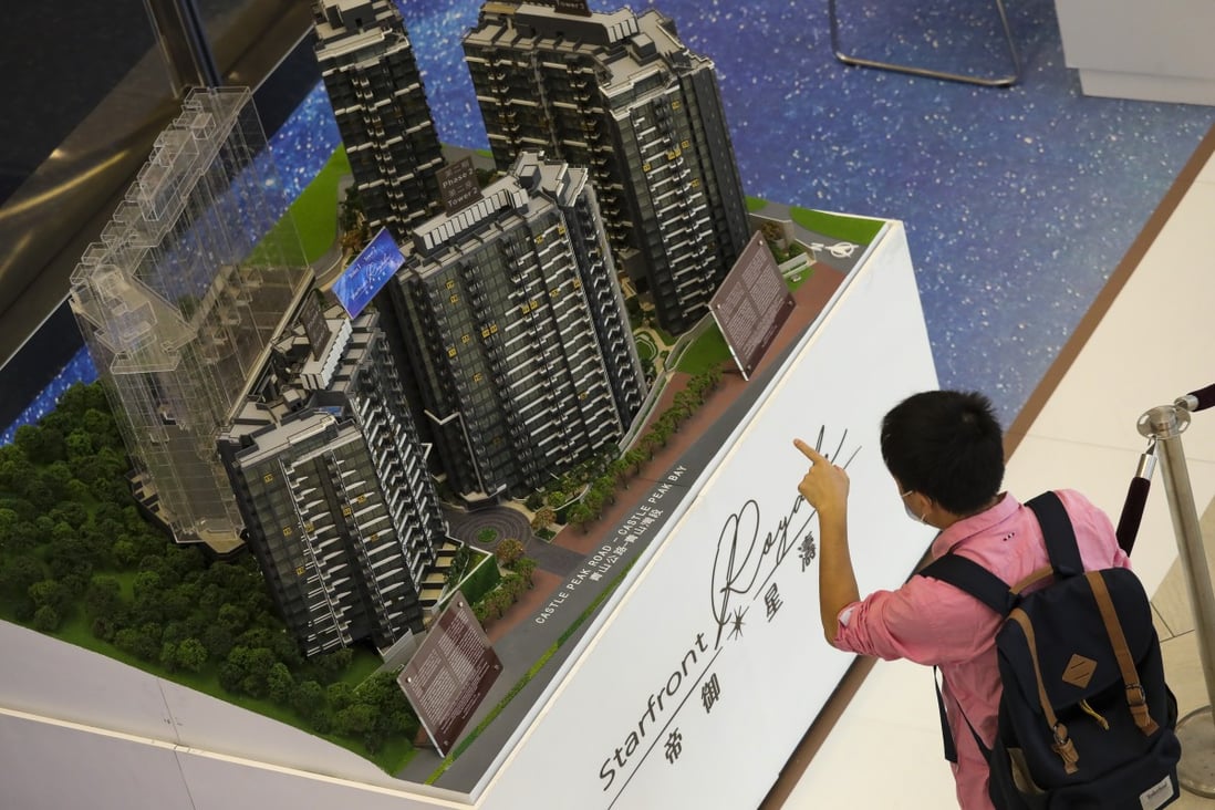 A visitor looking at the model of the Starfront Royale apartment complex in Tuen Mun on 1 November 2020, developed by Henderson Land Development’s Hong Kong Ferry Holdings and Empire Group. Photo: K.Y. Cheng
