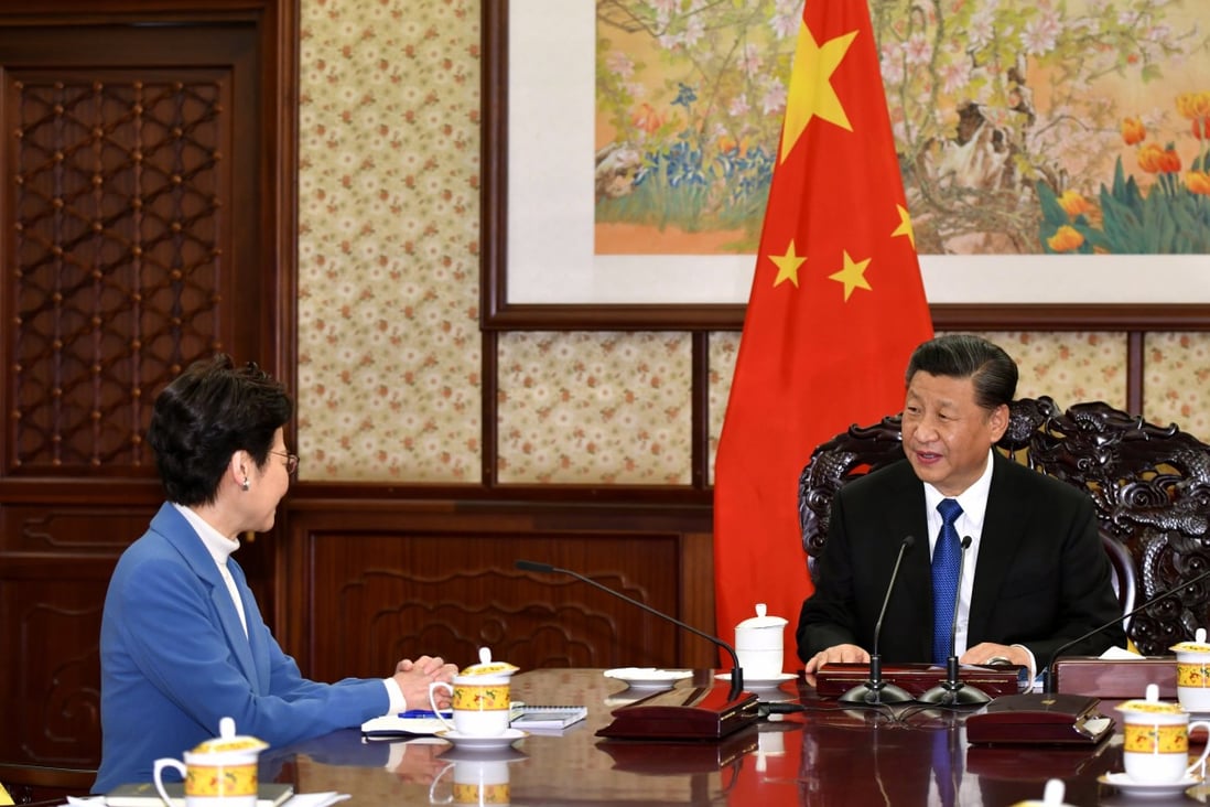 Carrie Lam sits down with Xi Jinping during last year’s annual visit to Beijing. Photo: ISD