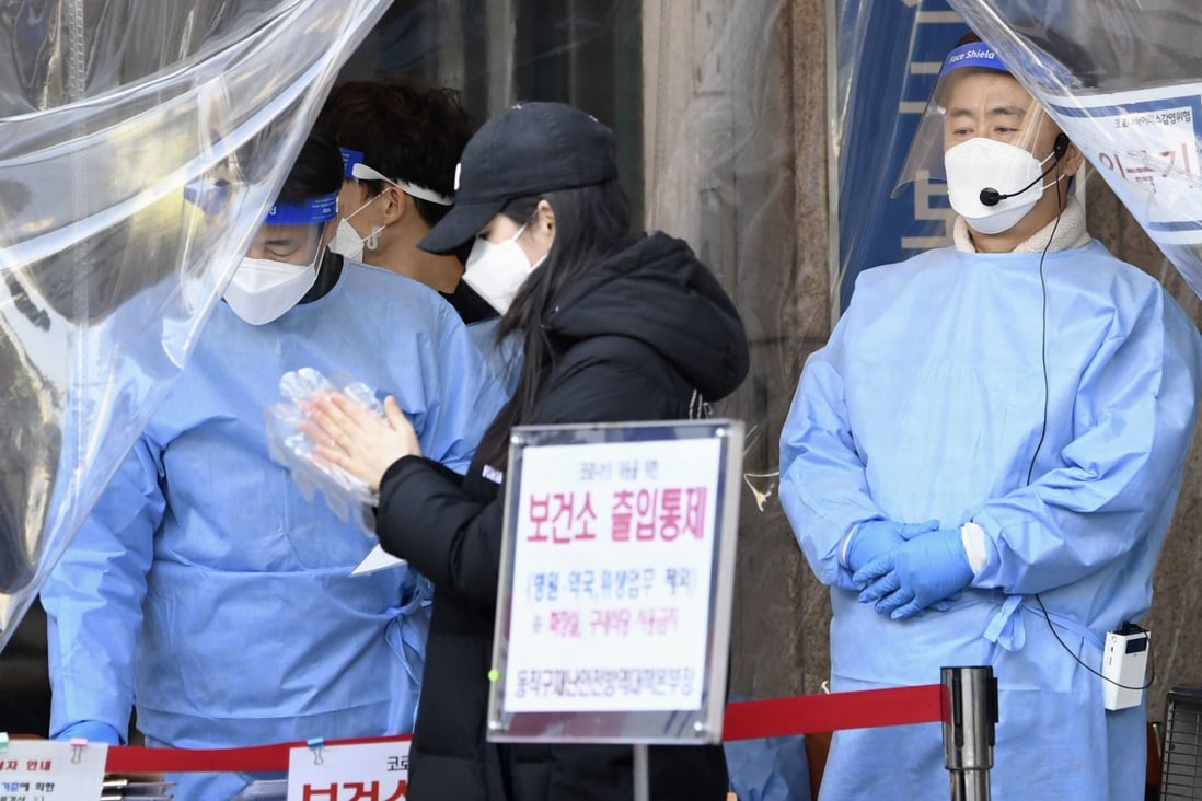A woman attends a coronavirus test centre in Seoul. Photo: Kyodo