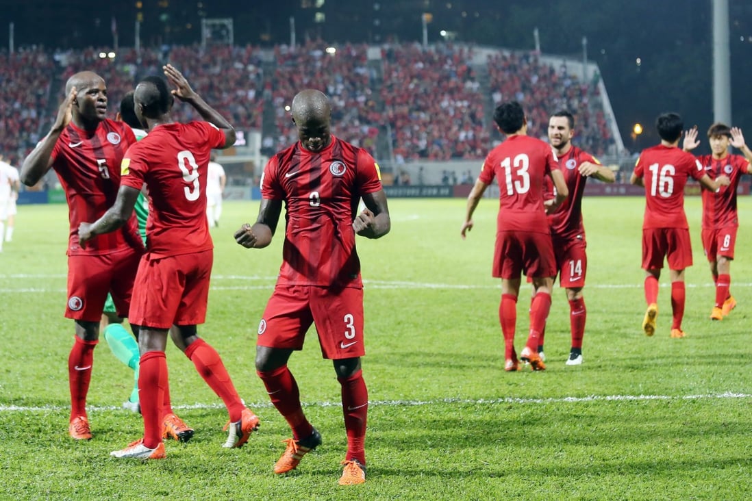 Hong Kong’s Festus Baise (No 3) celebrates with teammates after drawing with China in the 2018 Fifa World Cup Asian qualifying match at Mong Kok Stadium on November 17, 2015. Photo: SCMP