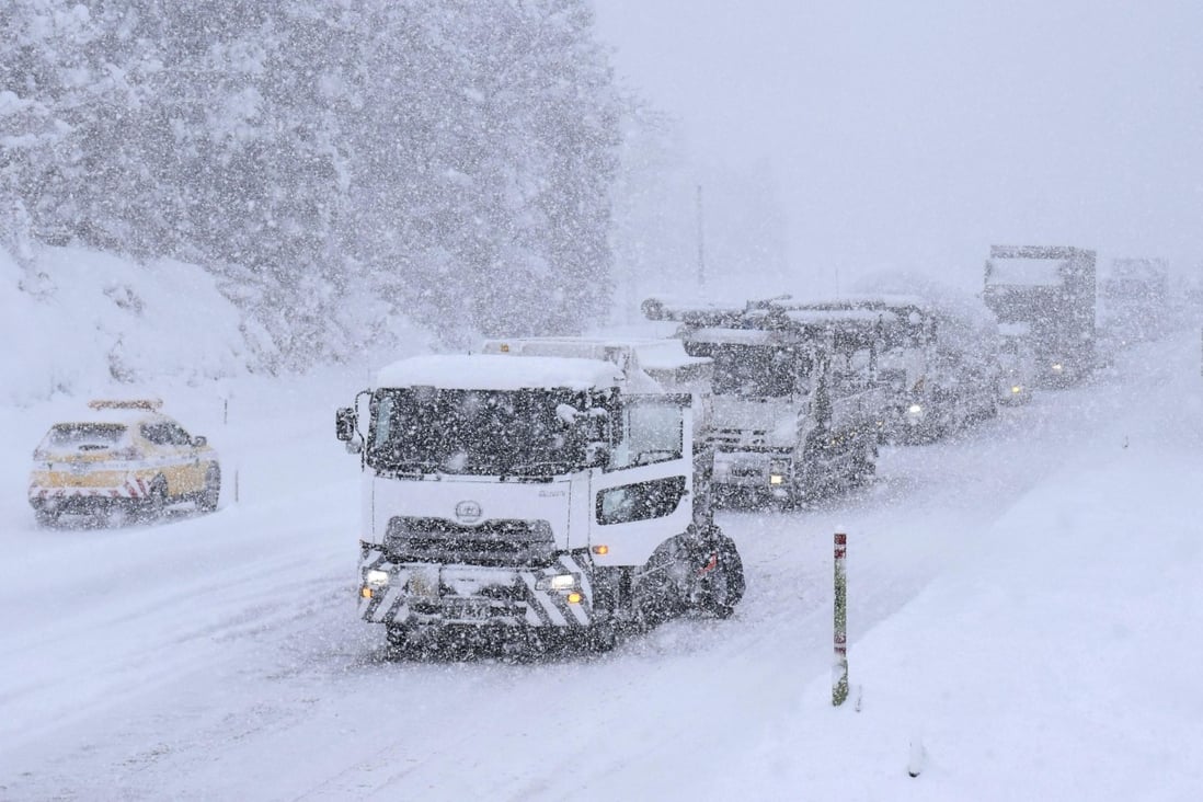 Trucks are stranded on a major road in Kitakami, Iwate Prefecture, after heavy snow in Japan. Photo: Kyodo