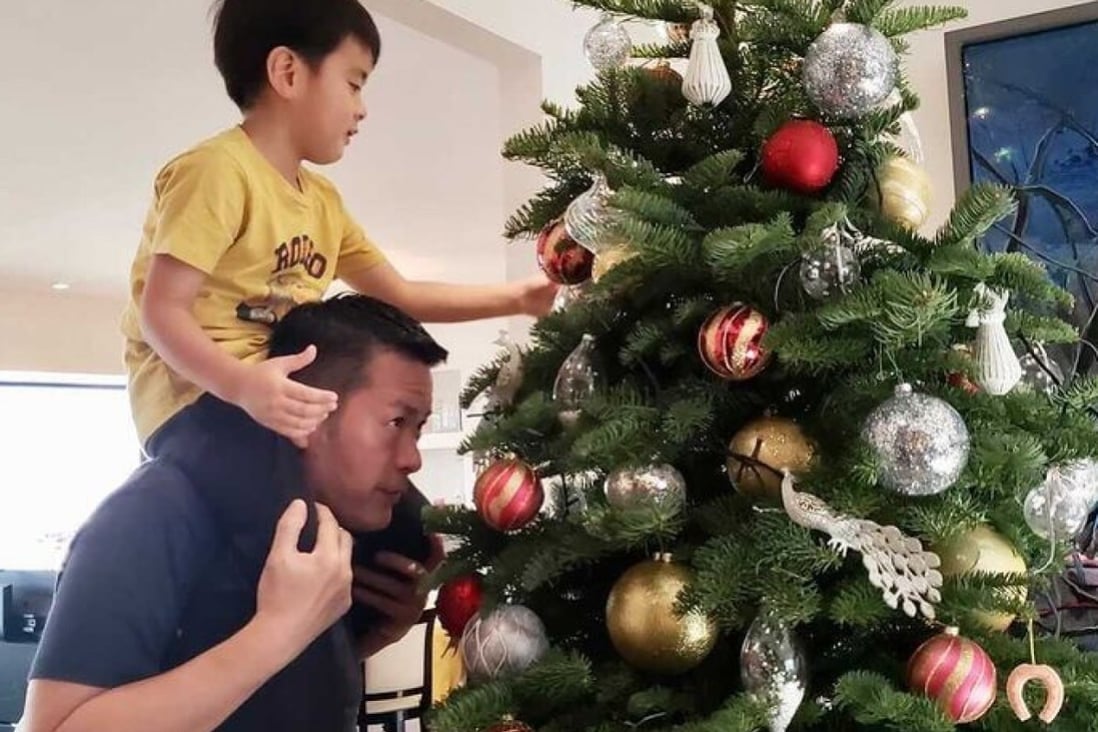 Satoru Mukogawa, executive chef of Sushi Kuu in Hong Kong, decorates a Christmas tree with his son. For many families in Japan, Christmas Day is “always KFC and a cake with a Santa Claus candle on top”, he says. Photo: Satoru Mukogawa