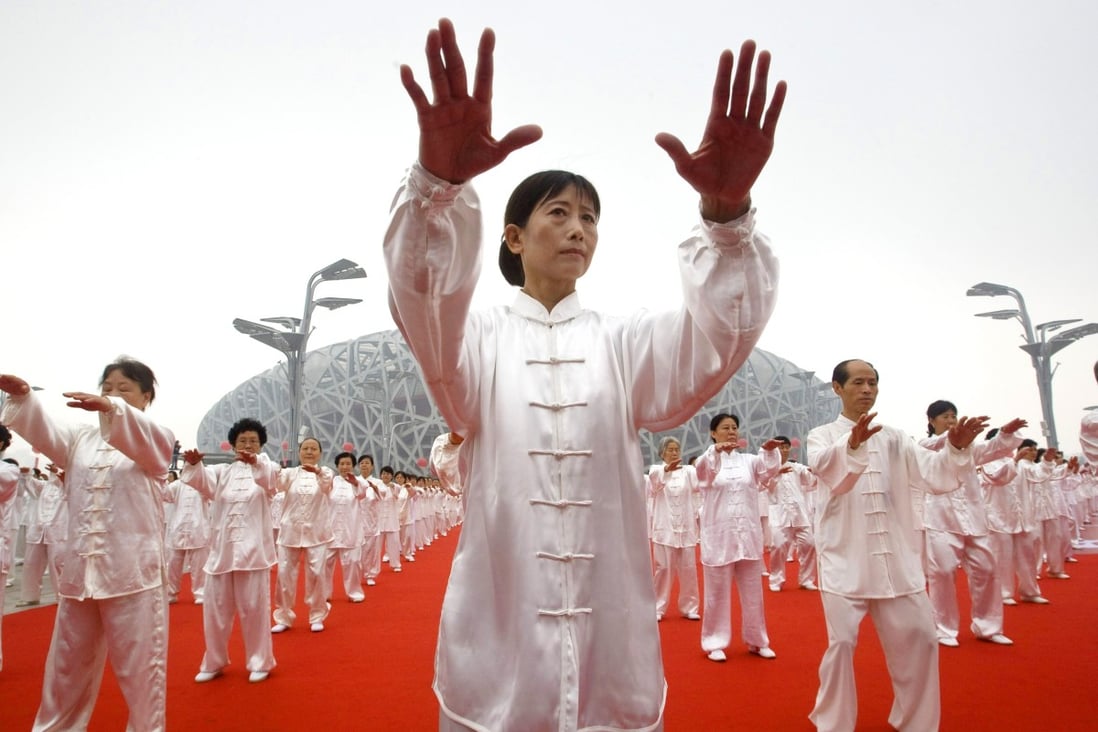 Tens of thousands of people perform tai chi to mark the first anniversary of the opening of the Beijing Olympics in 2009. The ancient Chinese martial art, widely practised around the world, has been granted intangible cultural heritage status by the United Nations’ cultural arm, Unesco. Photo: AP