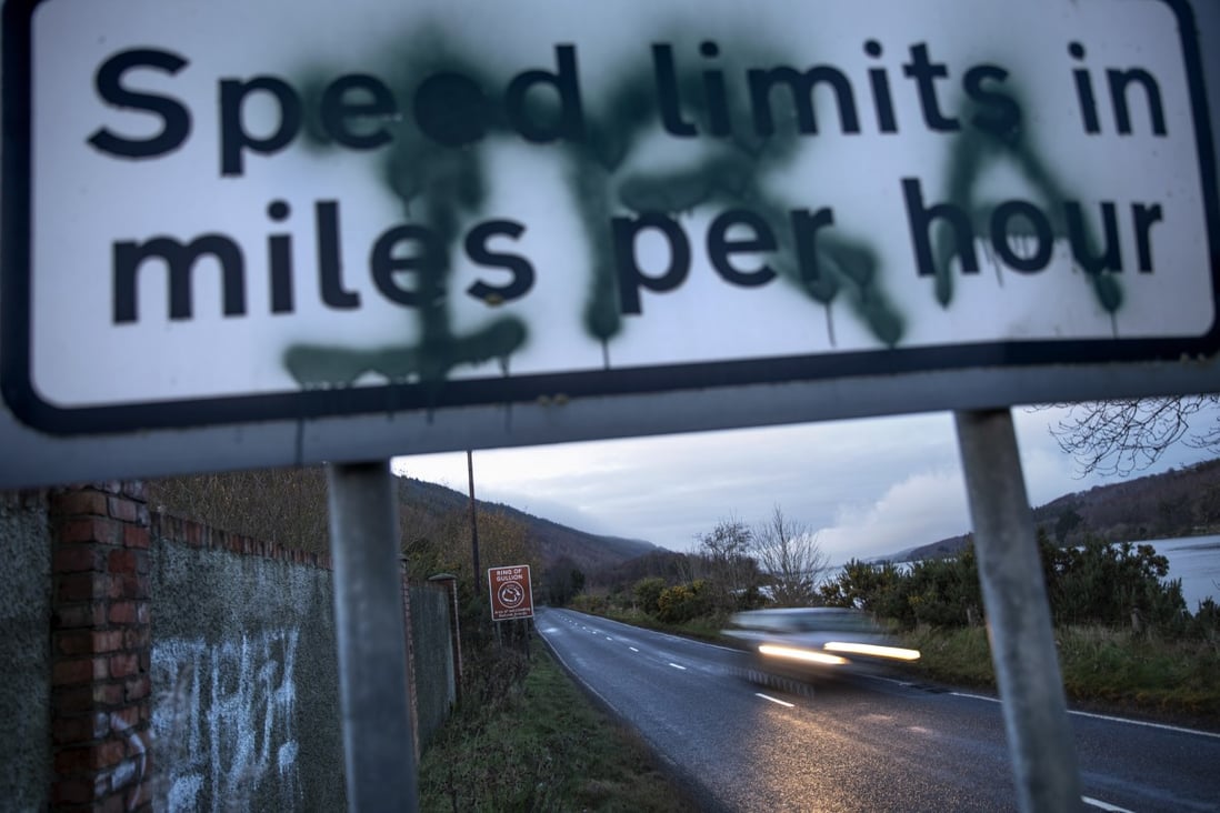 A sign in Newry, Northern Ireland, on the border between Northern Ireland and the Republic of Ireland, spray-painted with the initials of the Irish Republican Army on December 17, 2019. Photo: AP