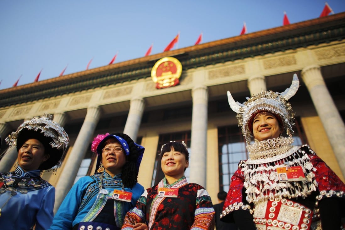 Ethnic minority delegates from Guizhou Province outside the Great Hall of the People in Beijing. Photo: Reuters