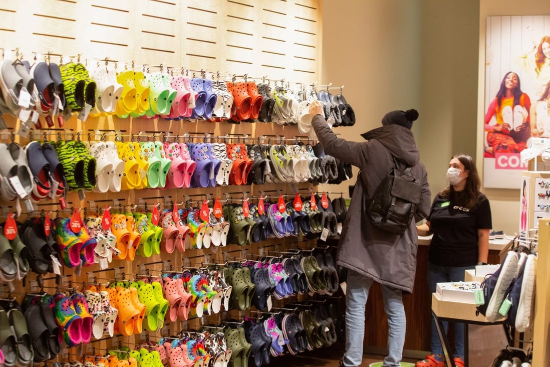A shopper browses shoes inside a Crocs store. The brand has leaned into the madness of 2020 and offered a counterpoint to the dismal news cycle. Photo: Bloomberg