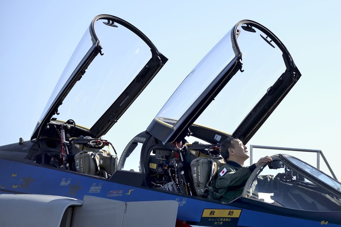Japanese Prime Minister Yoshihide Suga sits in the cockpit of a F-4EJ jet fighter as he reviews the Japan Air Self-Defence Force at the Air Self-Defence Force’s Iruma base in Sayama, Saitama Prefecture, Japan, 28 November 2020. Photo: EPA-EFE
