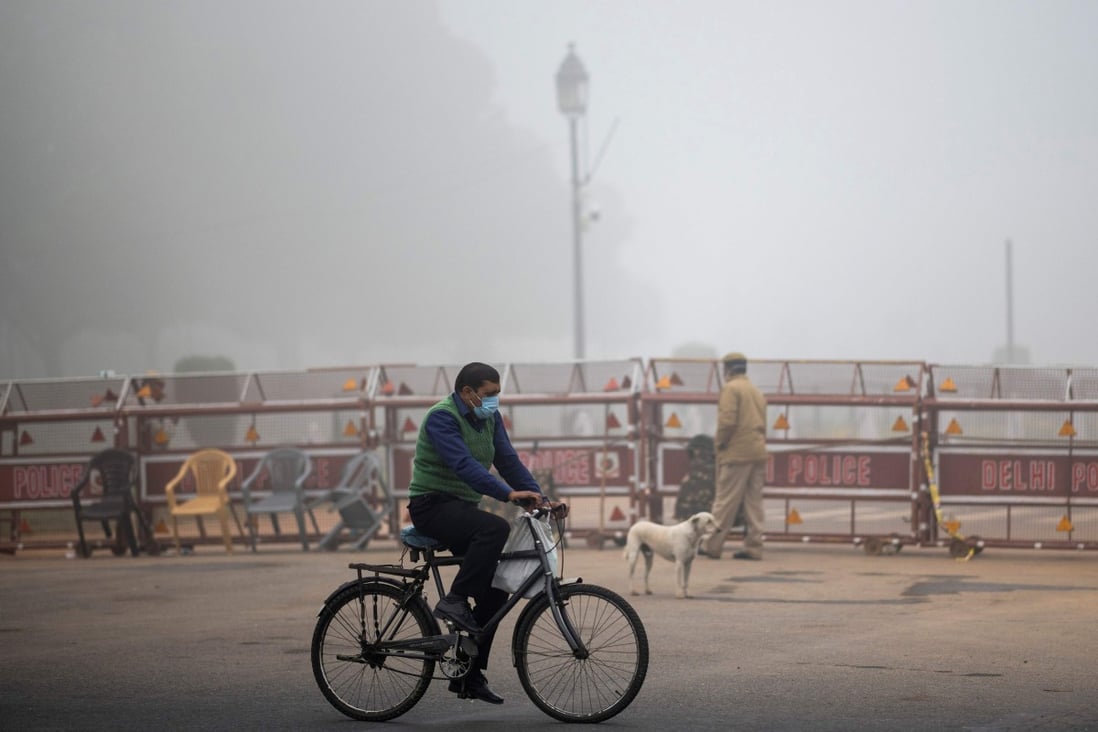 A man rides a bicycle along a street amid smoggy conditions in New Delhi, which is the world’s most polluted capital. Photo: AFP