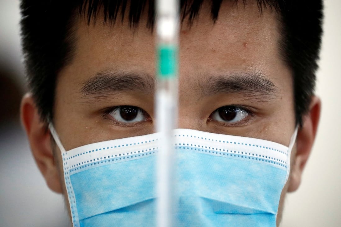 A man works in a Sinovac Biotech lab in Beijing developing an experimental Covid-19 vaccine. Photo: Reuters