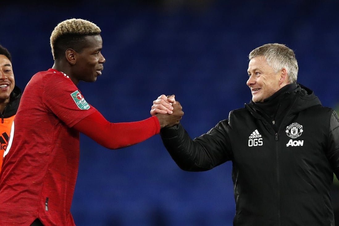 Manchester United manager Ole Gunnar Solskaer clasps hands with Paul Pogba after the Carabao Cup quarter-final victory over Everton on December 23. Photo: EPA