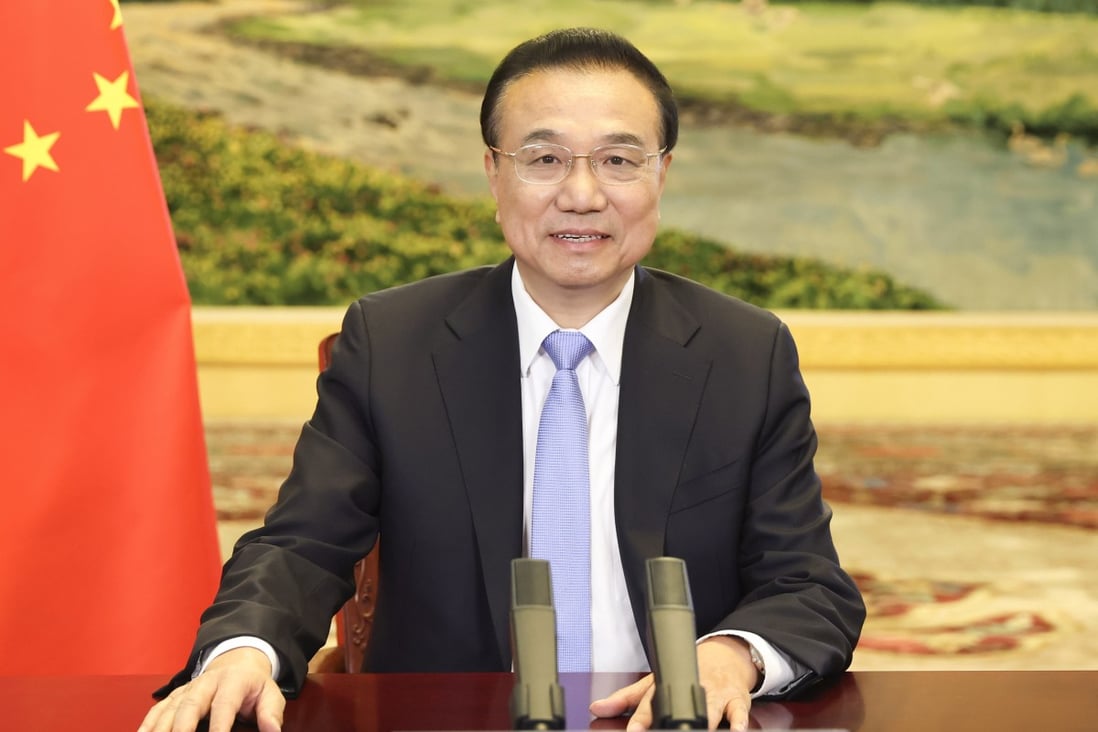 Chinese Premier Li Keqiang, shown via video link at an Organisation for Economic Cooperation and Development event last week, has called the Dutch and Spanish prime ministers in a bid to shore up support for the proposed EU-China trade deal. Photo: Xinhua