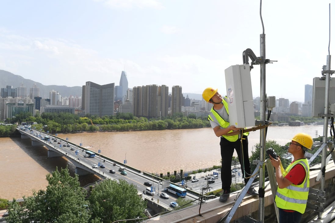 China Telecom technicians test equipment at a 5G base station in China’s Gansu province on May 16, 2019. Photo: Reuters