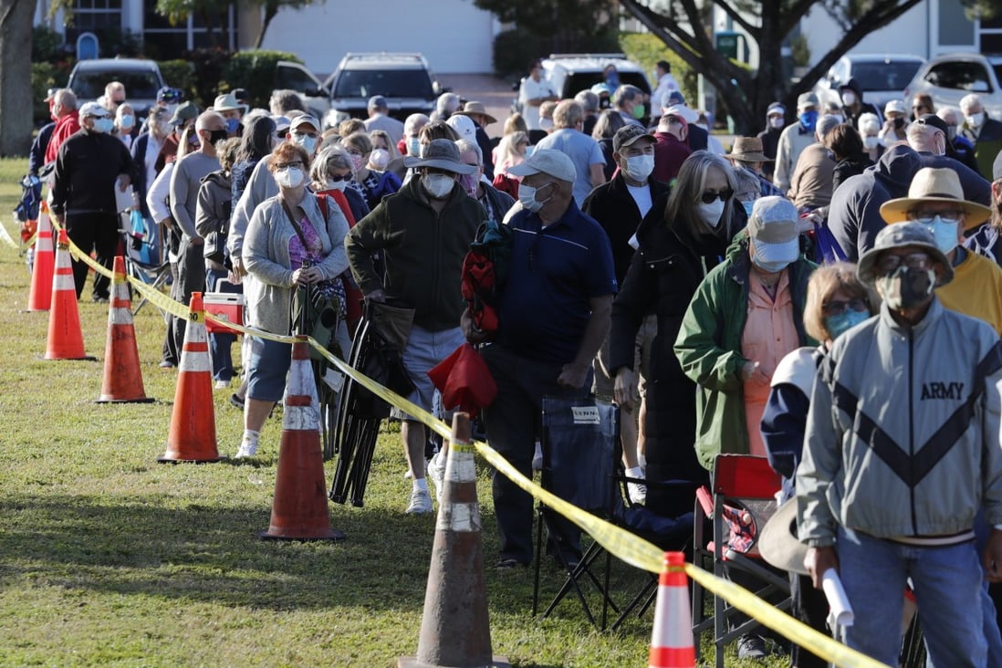 Cape Coral, Florida residents wait in line to receive a Covid-19 vaccine. Photo: AP