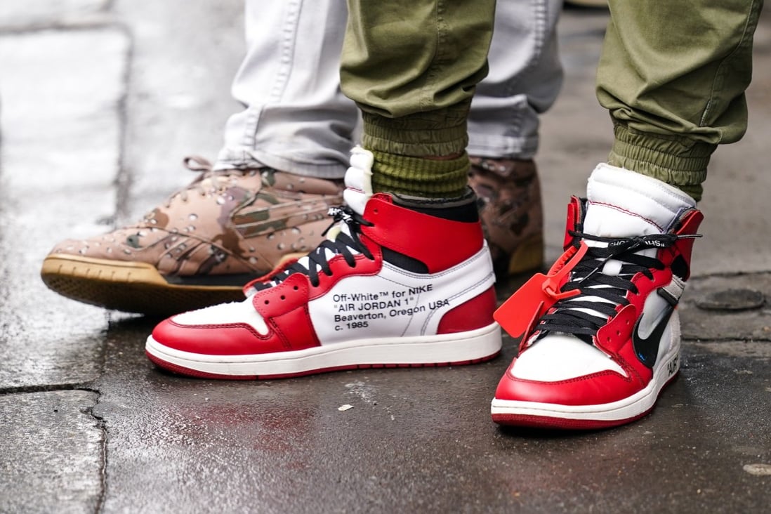 A guest at Paris Fashion Week wears “Off-White for Nike” Air Jordan 1 sneakers. 2020 was a banner year for streetwear and sneaker aficionados. Photo: Getty Images