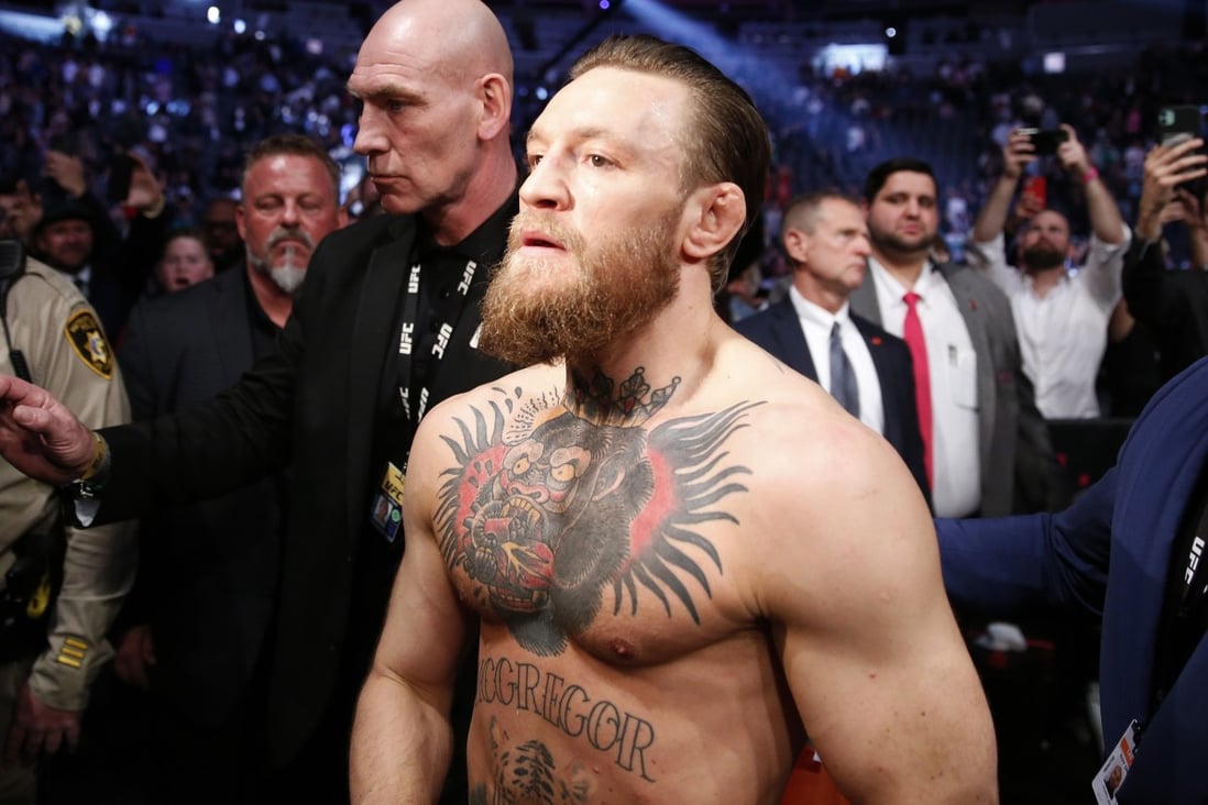 Conor McGregor celebrates his first round TKO victory against Donald Cerrone as he exits the arena at UFC 246. Photo: AFP