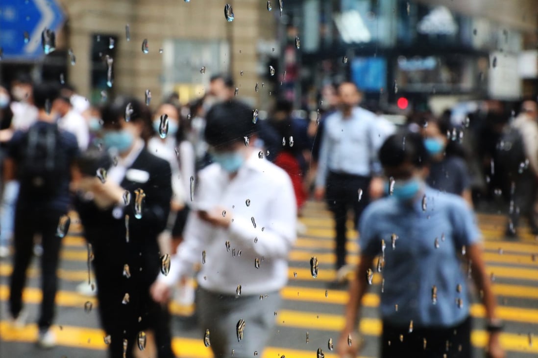 A view through a window of office workers in the financial district of Central. Hong Kong faces changed circumstances and things will never return to the way they were. Photo: Nora Tam