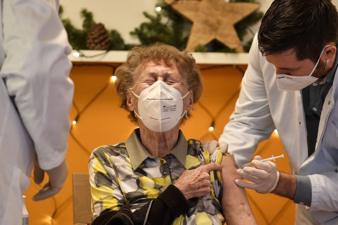 A resident of a nursing home gets a Covid-19 vaccine jab in Cologne, Germany, on December 27. With Europeans and North Americans now rolling up their sleeves to receive coronavirus vaccines, the route out of the pandemic now seems clear to many in the West, even if the roll-out will take many months. But for poorer countries, the road will be far longer and rougher. Photo: AP